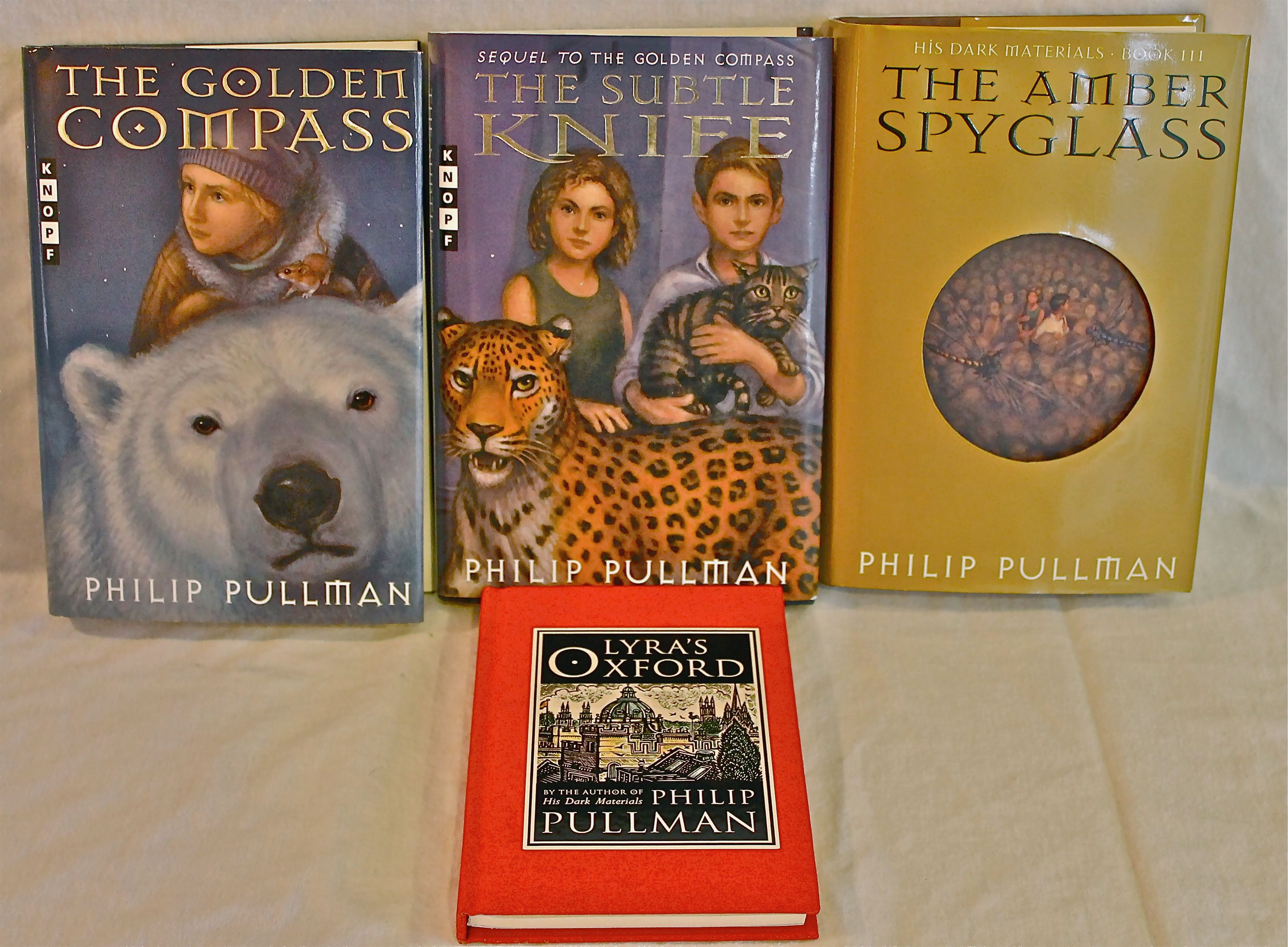 The Golden Compass/ The Subtle Knife/The Amber Spyglass/Lyra's Oxford